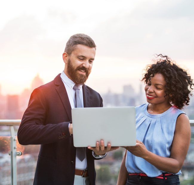 Businesspeople on top of roof in London